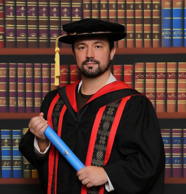 Dr. Daniel Flash in his doctoral gown at the WONM University convocation in Malaysia